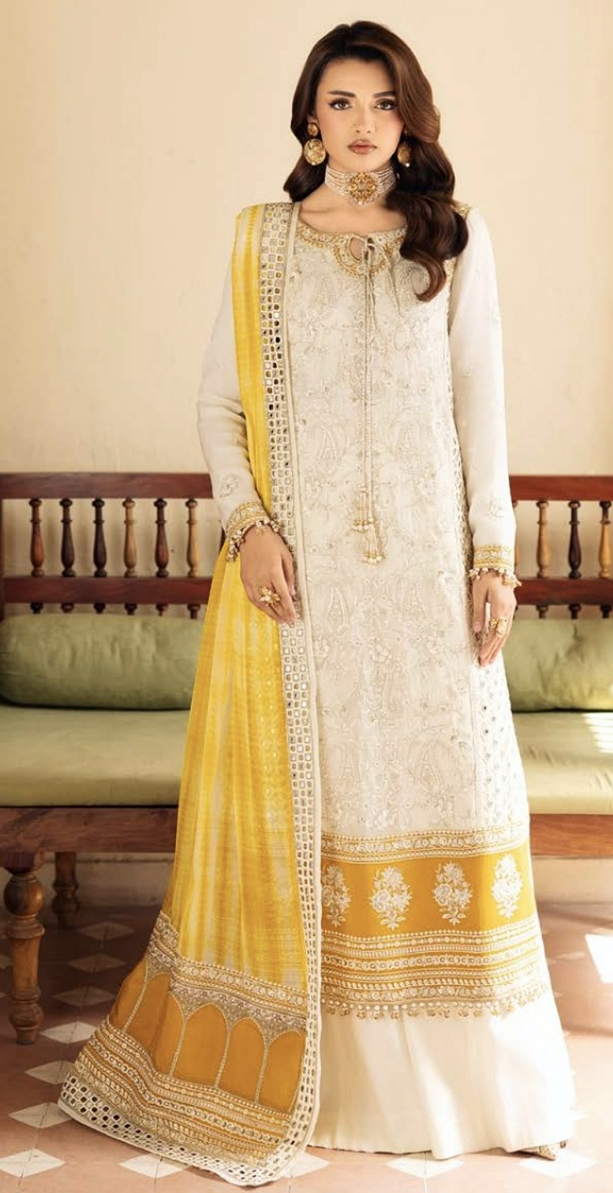 Ivory embroidered kurta with a haldi-yellow mirror-work dupatta