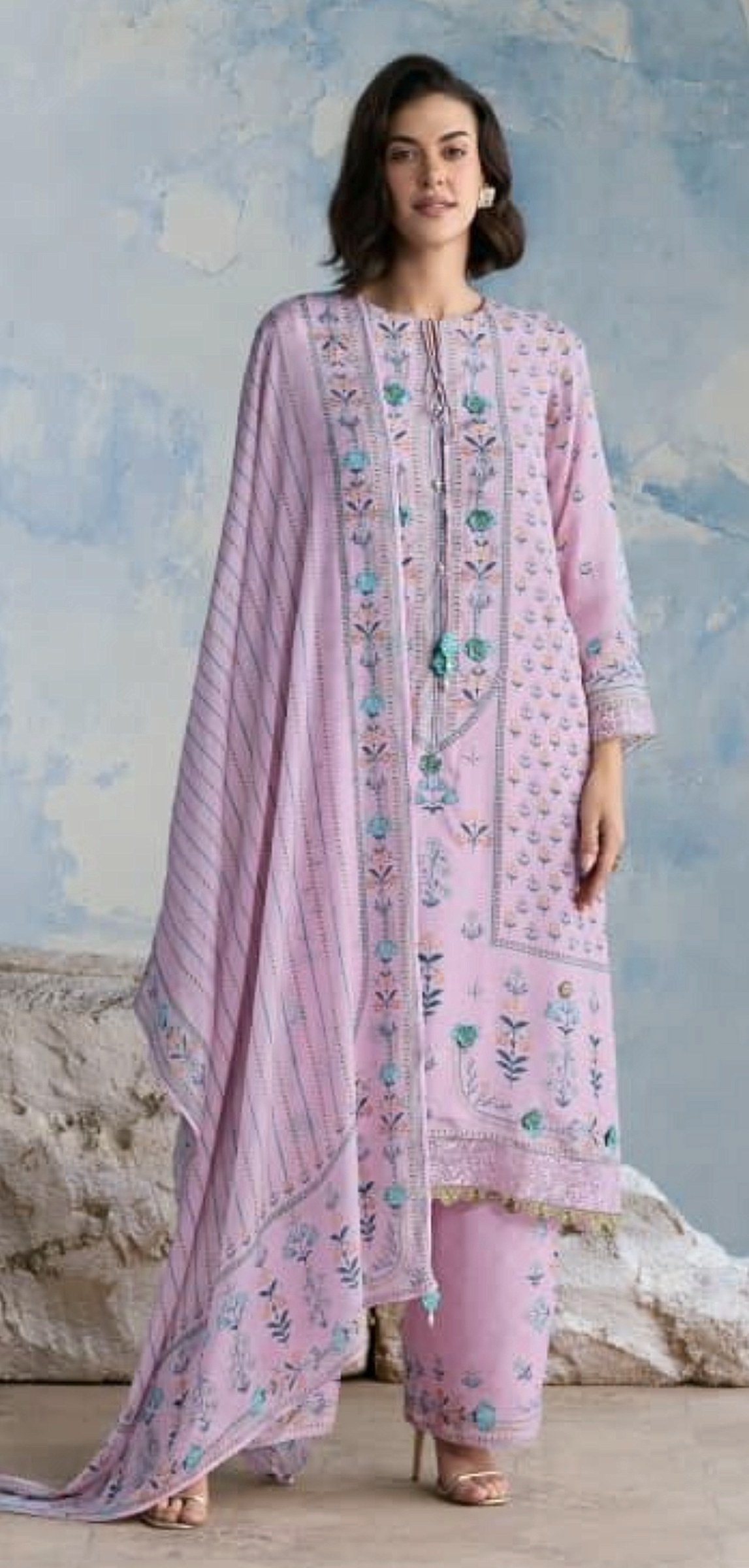 Lilac printed suit with turquoise floral embroidery and a striped dupatta