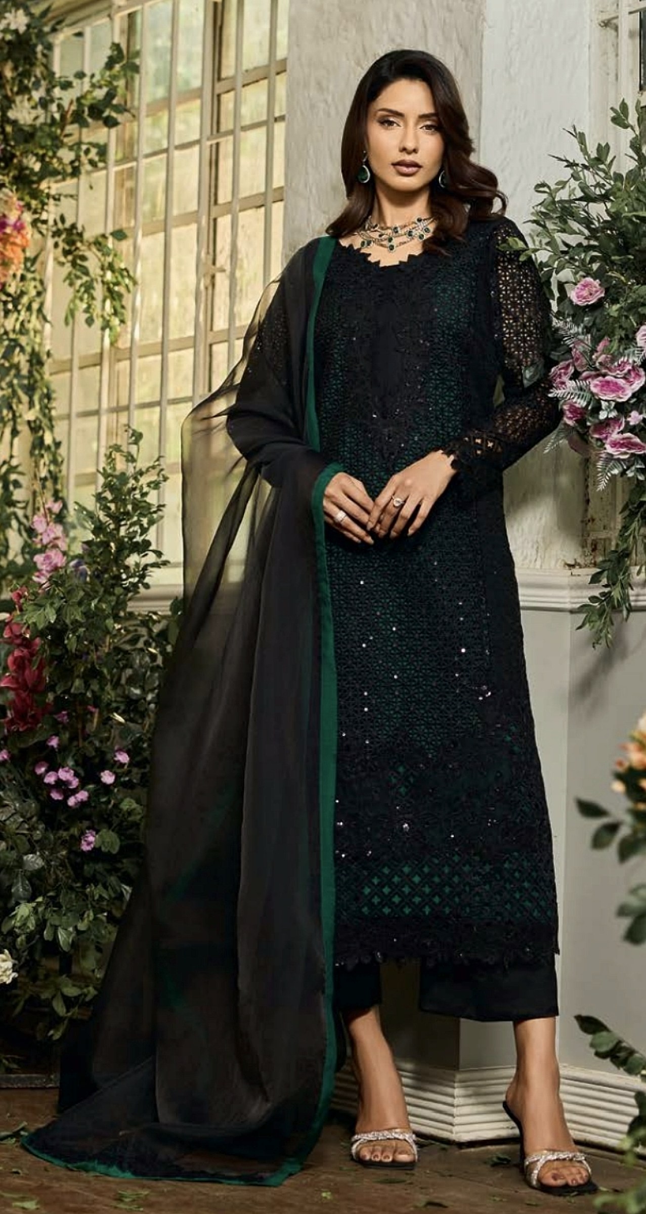 Black cutwork suit with emerald lining and a sheer dupatta